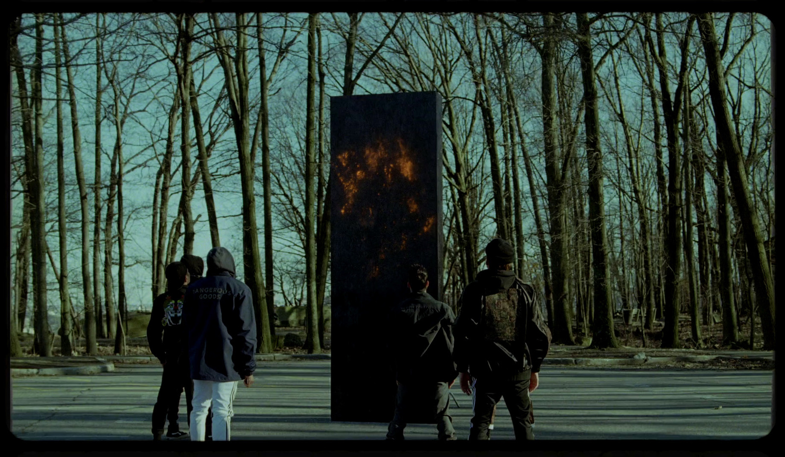 a group of people standing next to a fire place