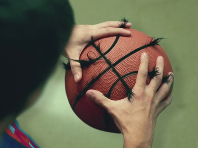 a person holding a basketball in their hands