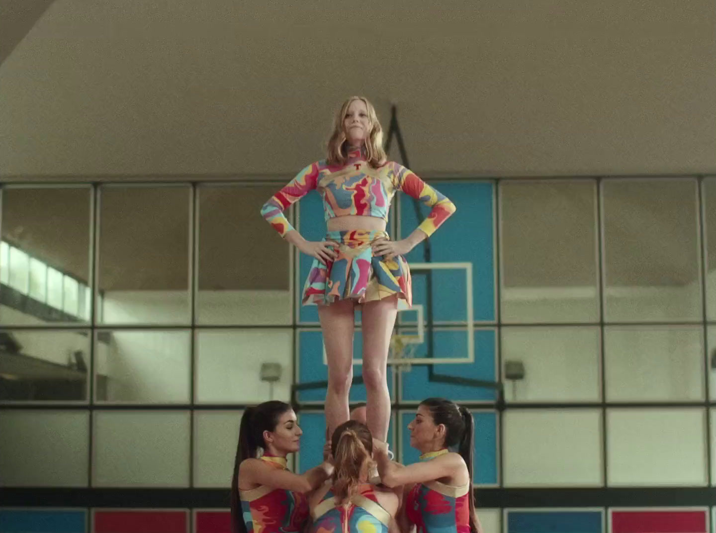 a group of young women standing on top of each other