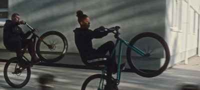 a man riding a bike next to a woman on a bike