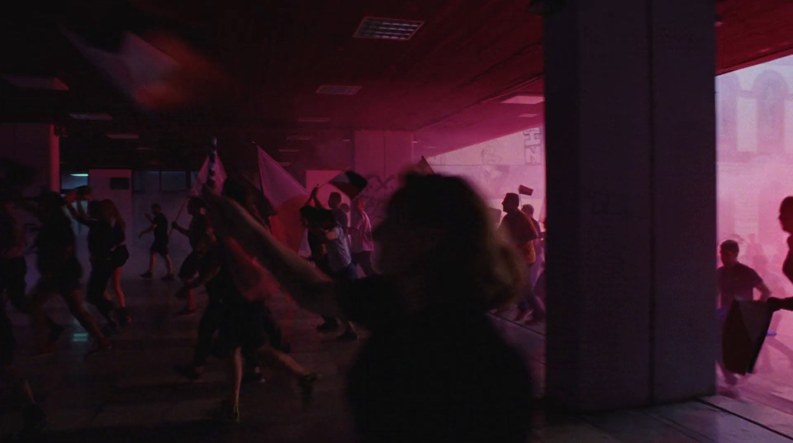 a group of people dancing in a dark room