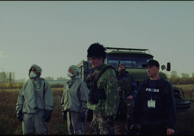 a group of people standing in a field