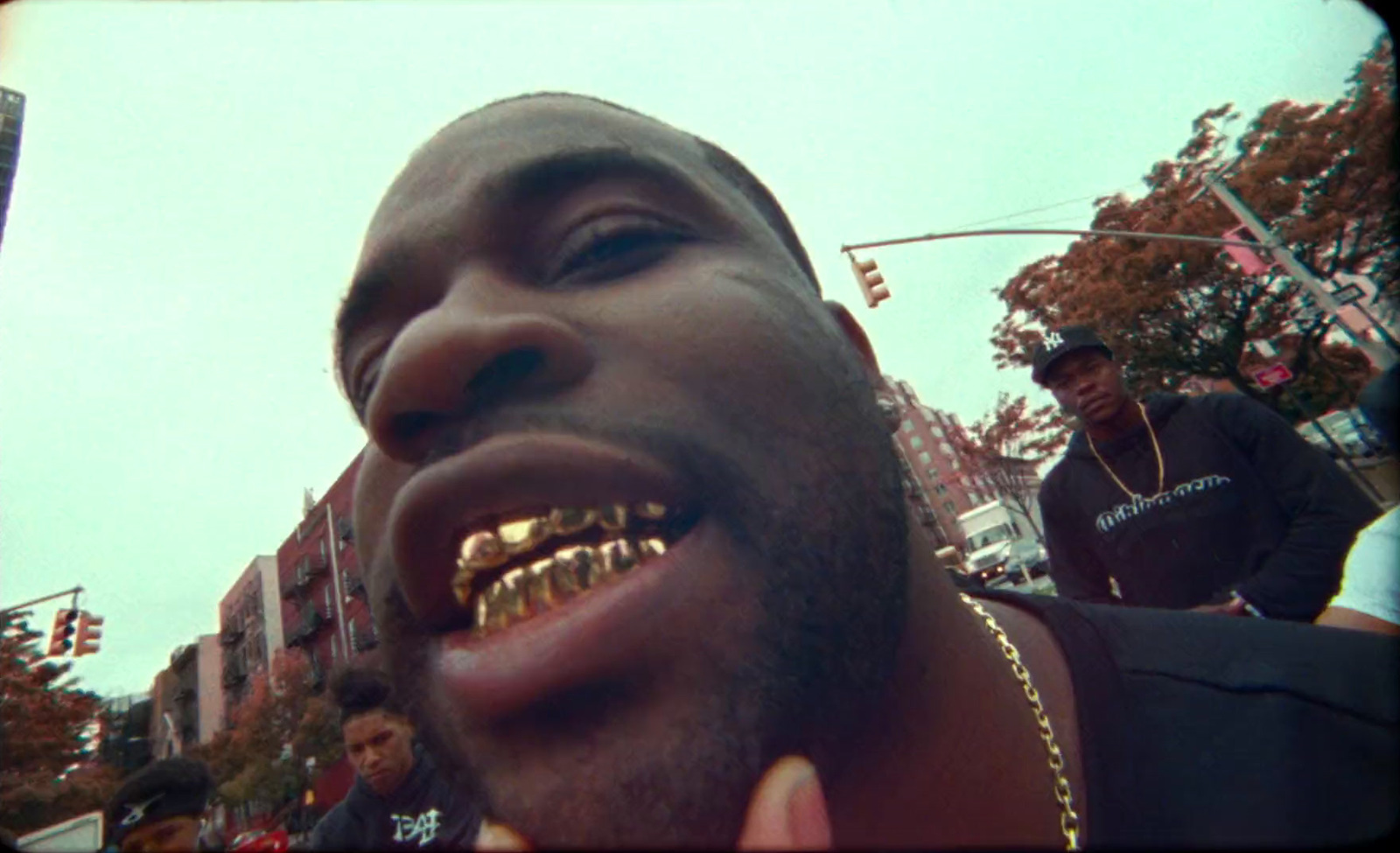 a man with a gold grill on his mouth