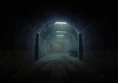 a dark tunnel with a light at the end