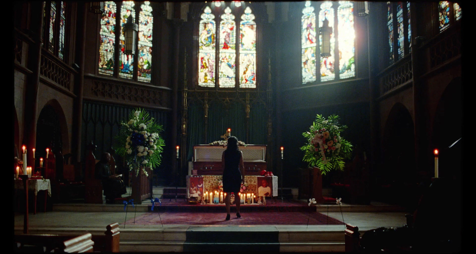 a priest standing at the alter of a church