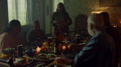 a group of people sitting around a dinner table