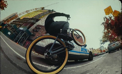 a person riding a bike on the back of a car