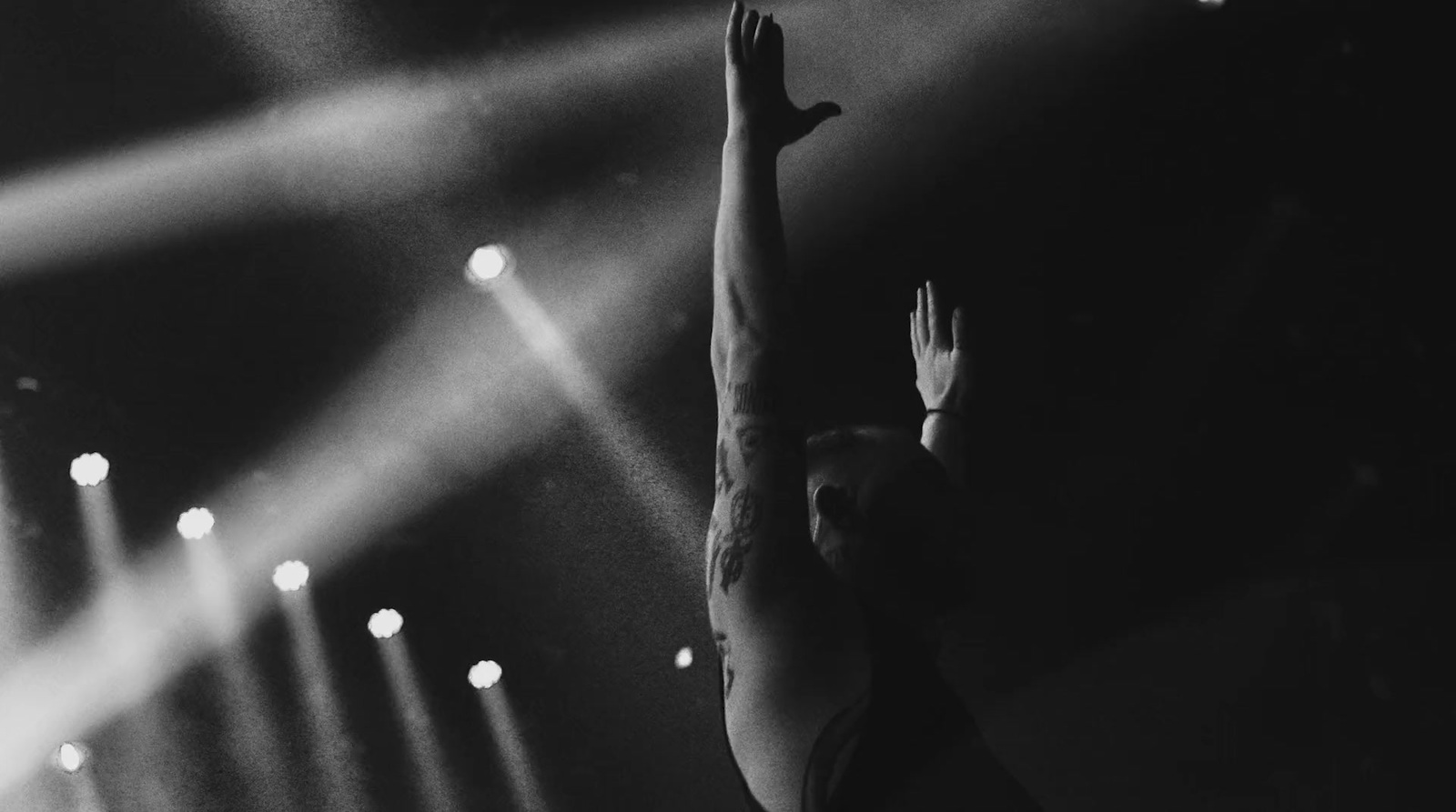 a black and white photo of a person on a stage