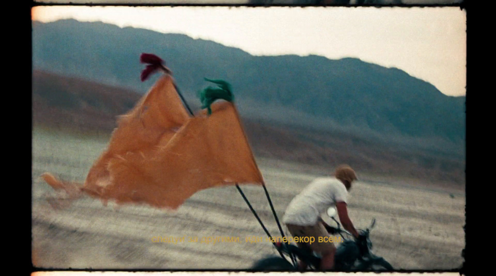 a man riding a horse pulling a kite