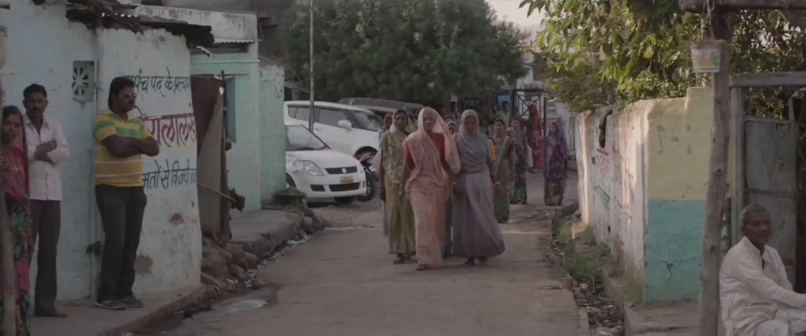 a group of people walking down a street