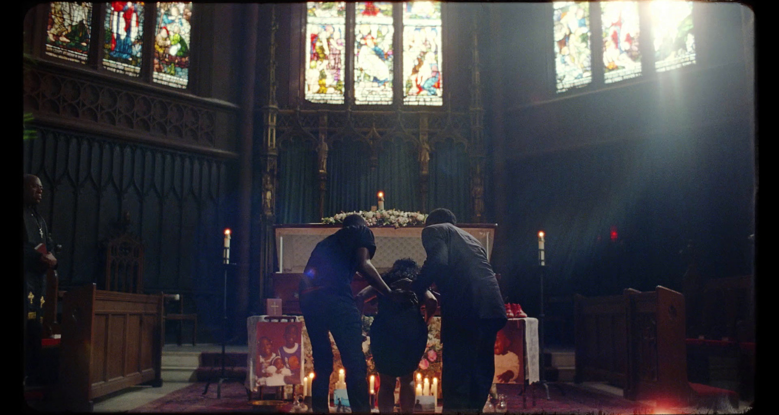 a couple of people that are standing in a church