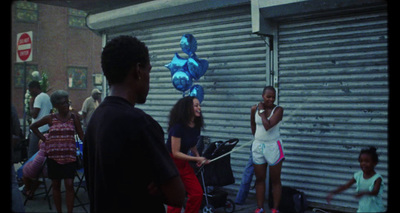 a group of people standing in front of a building