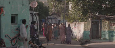 a group of people walking down a street