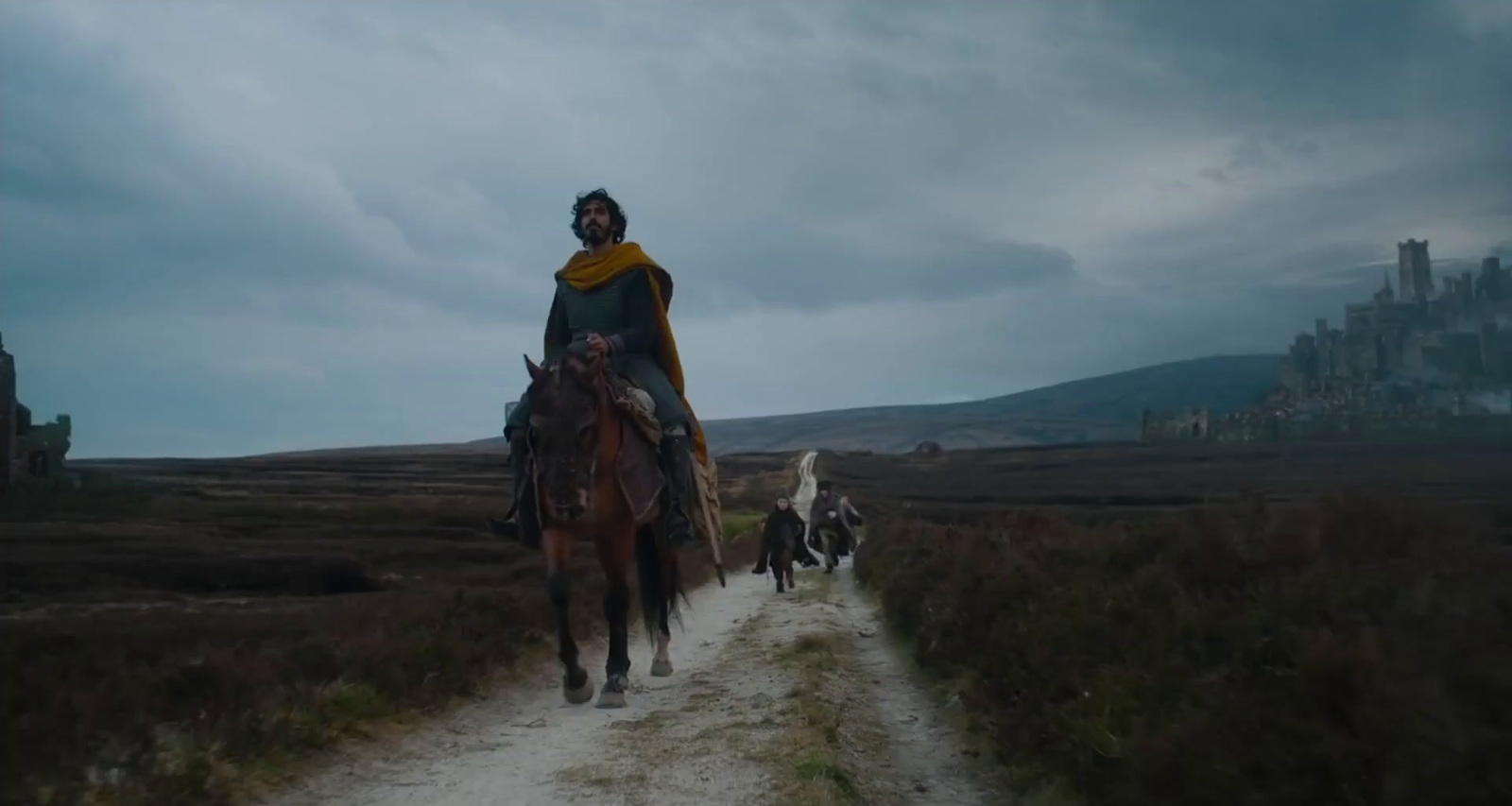 a man riding on the back of a brown horse