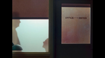 a door with a sign on it that says office of the editor