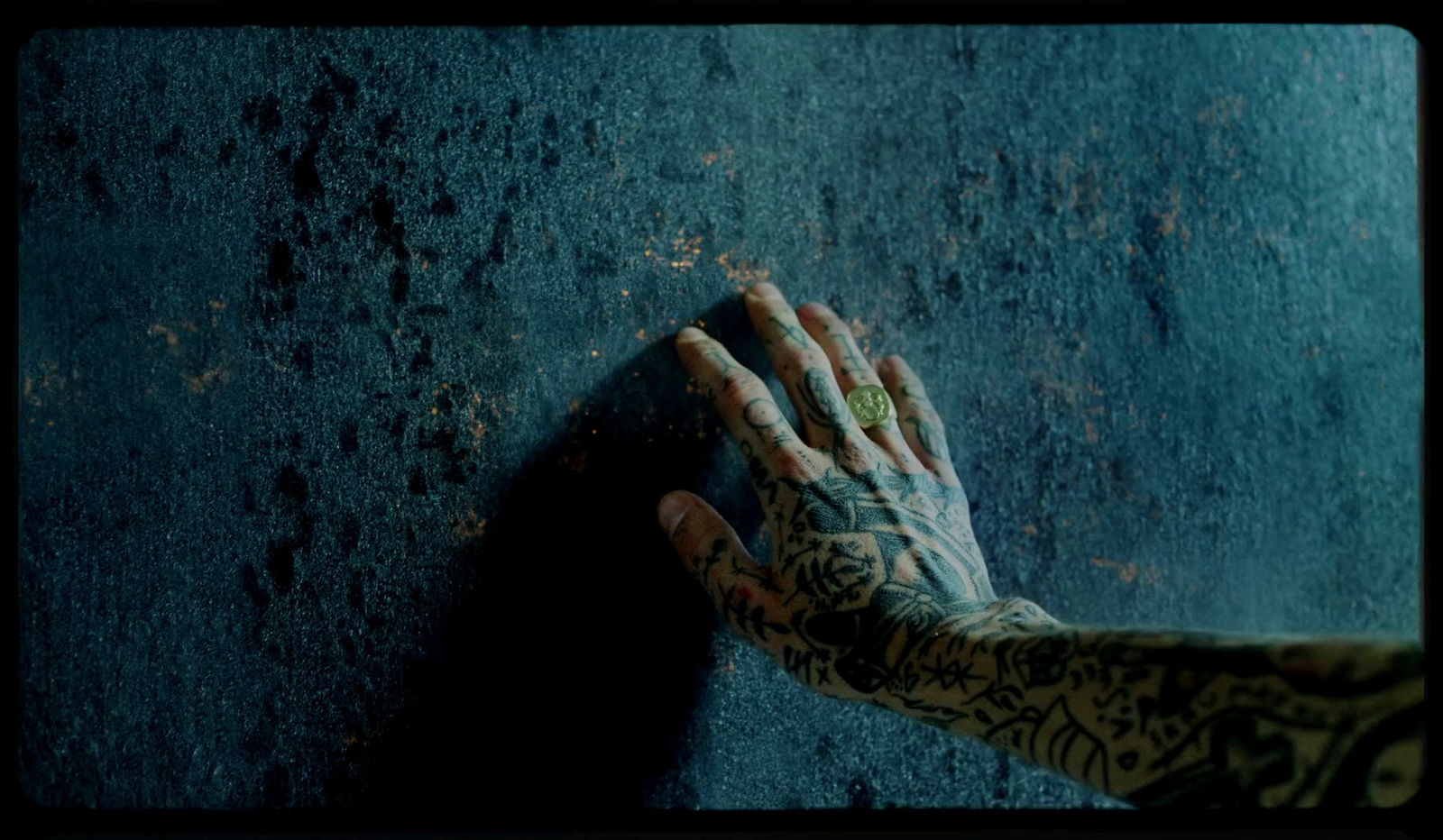 a person's hand with tattoos on it