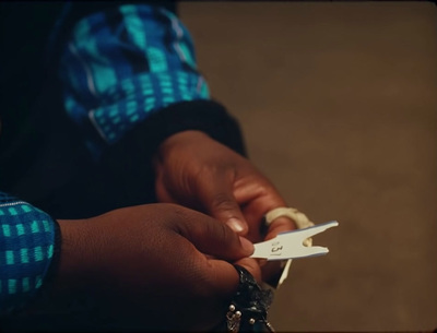 a person holding a pair of scissors in their hands