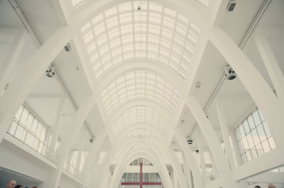 a group of people standing in a large building