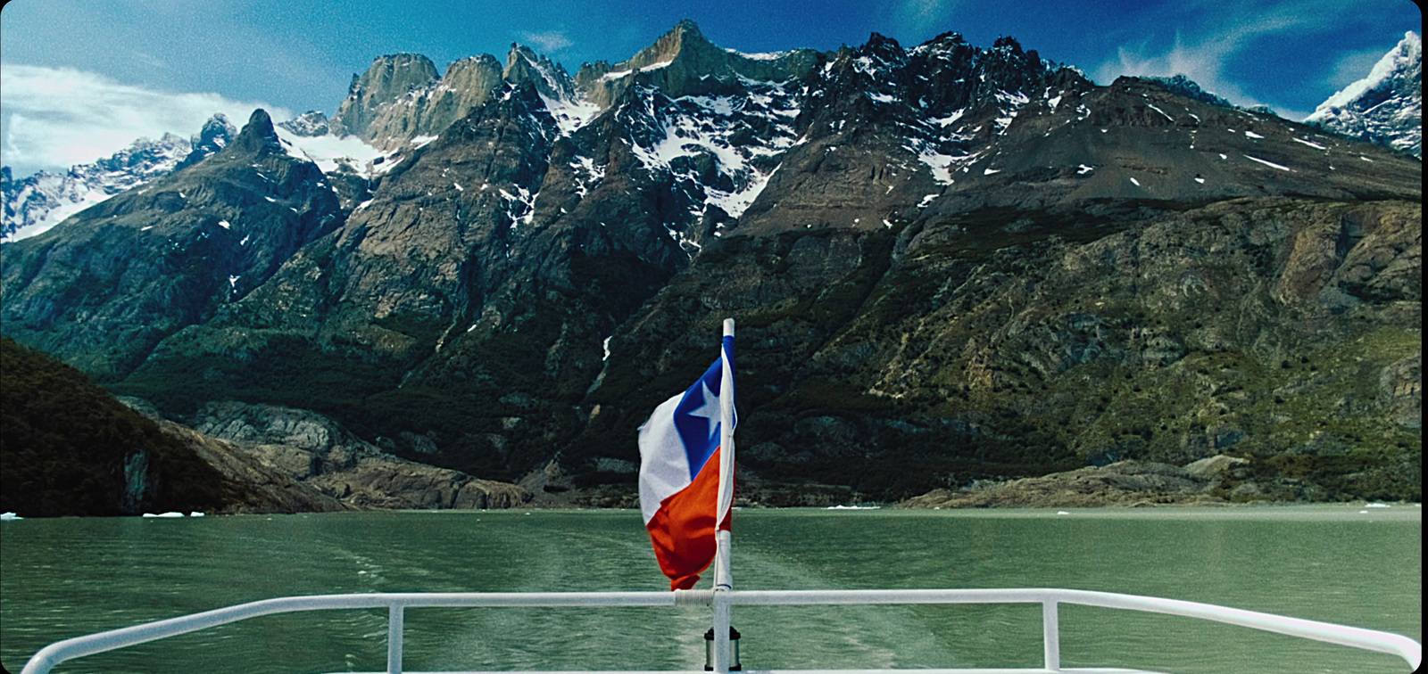 a view of a mountain range from a boat