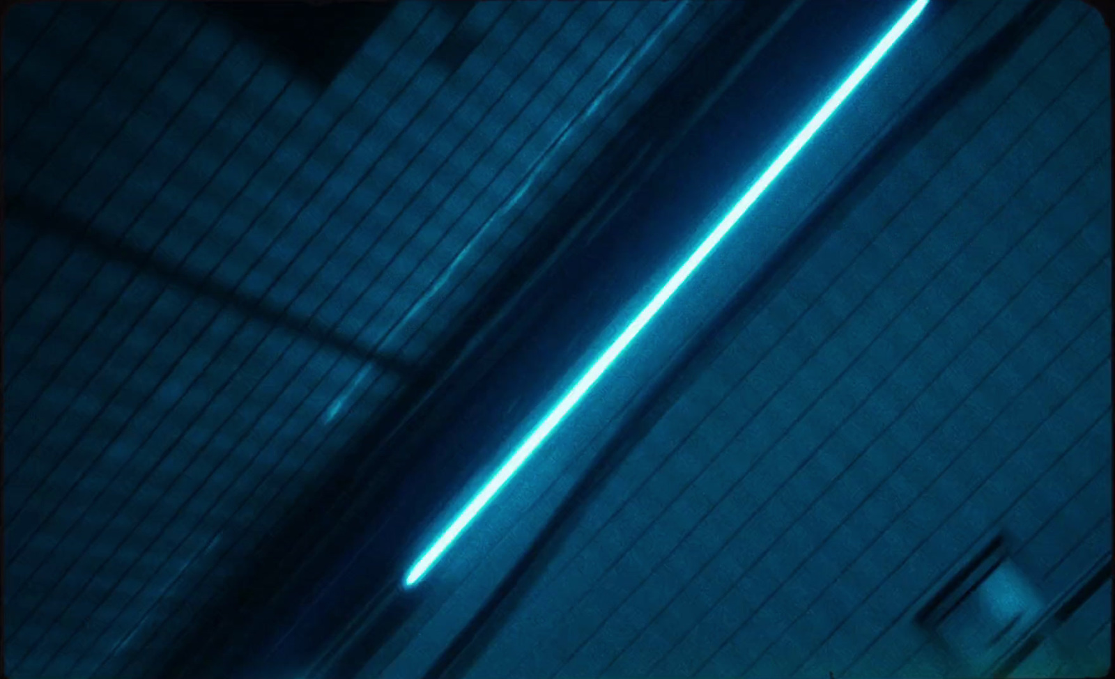 a close up of a wall with a blue light