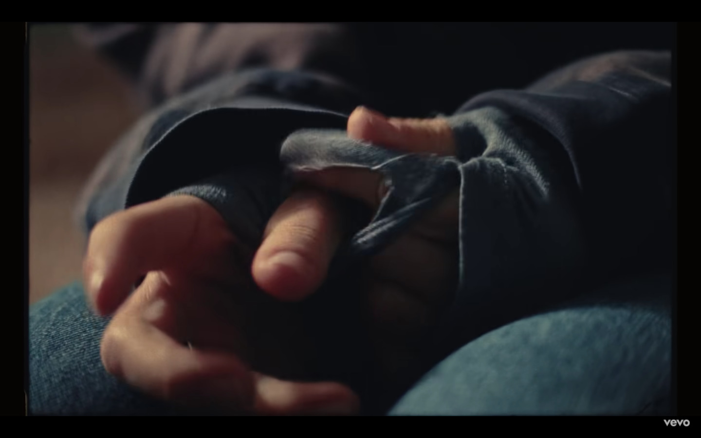 a close up of a person's hands holding something