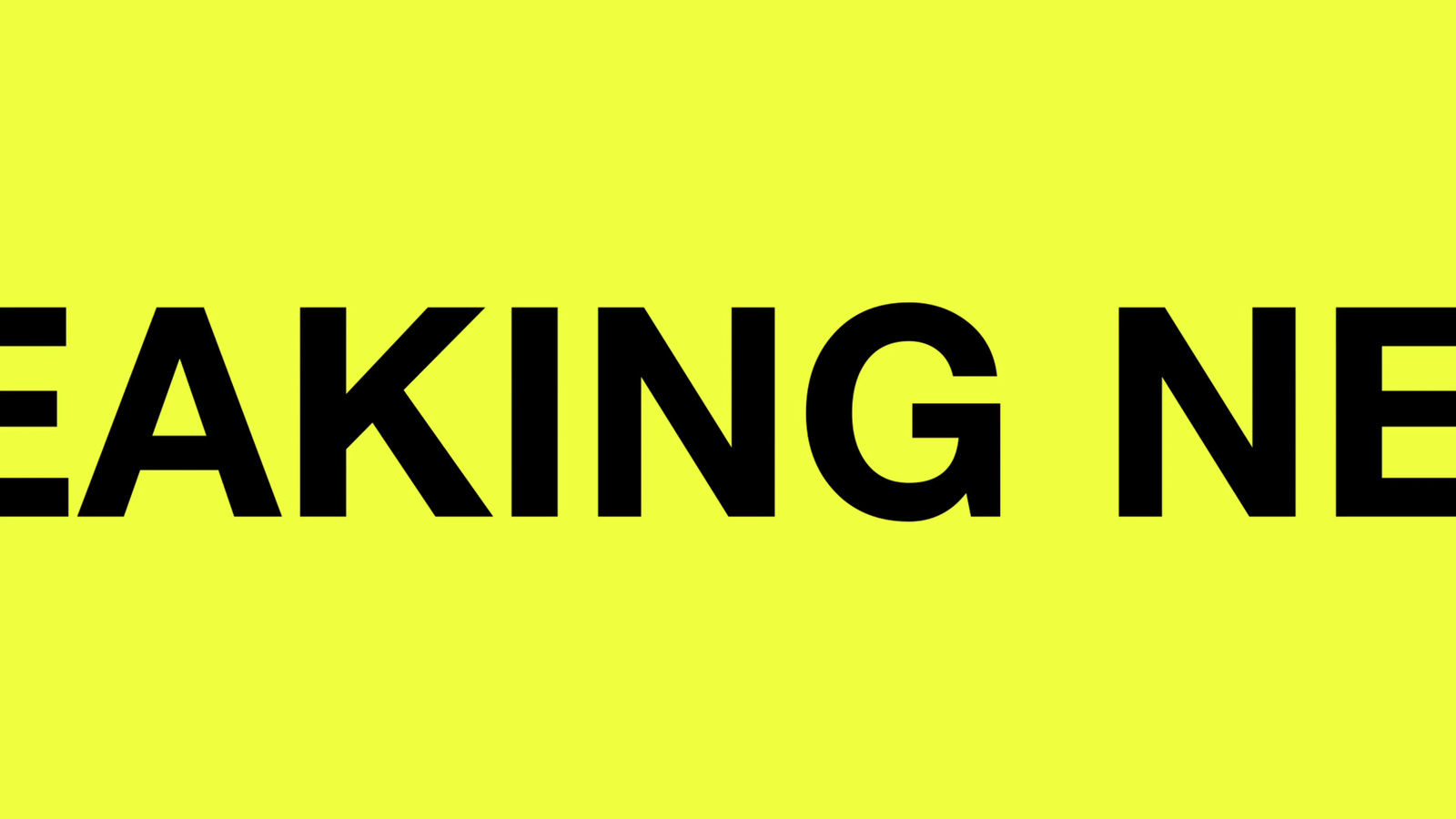 a black and yellow sign that says breaking news