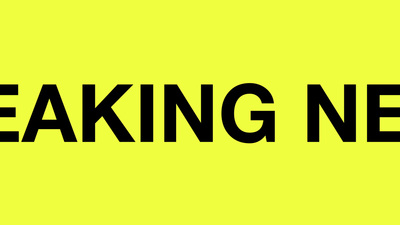 a black and yellow sign that says breaking news