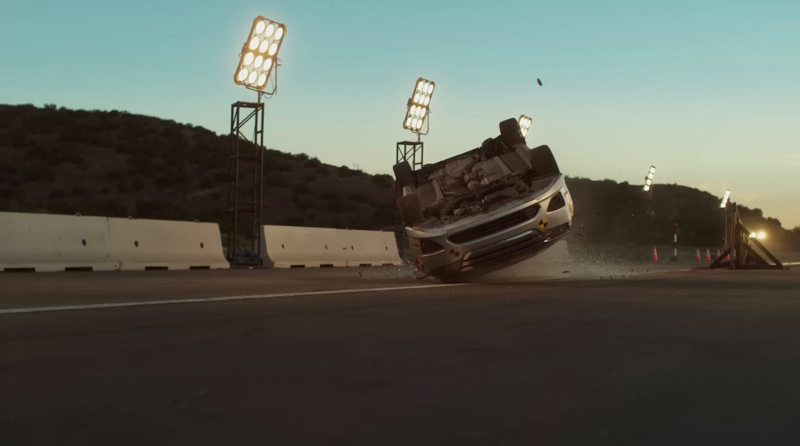 a car that is on its side in the street