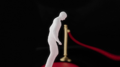 a white figure standing on top of a red object