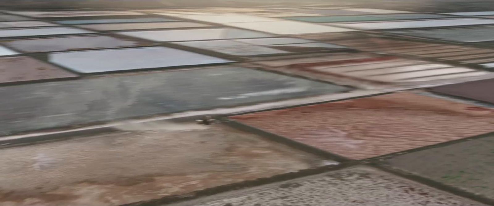 a tile floor with different colors and shapes