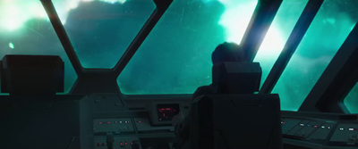 a man sitting in the cockpit of a space ship