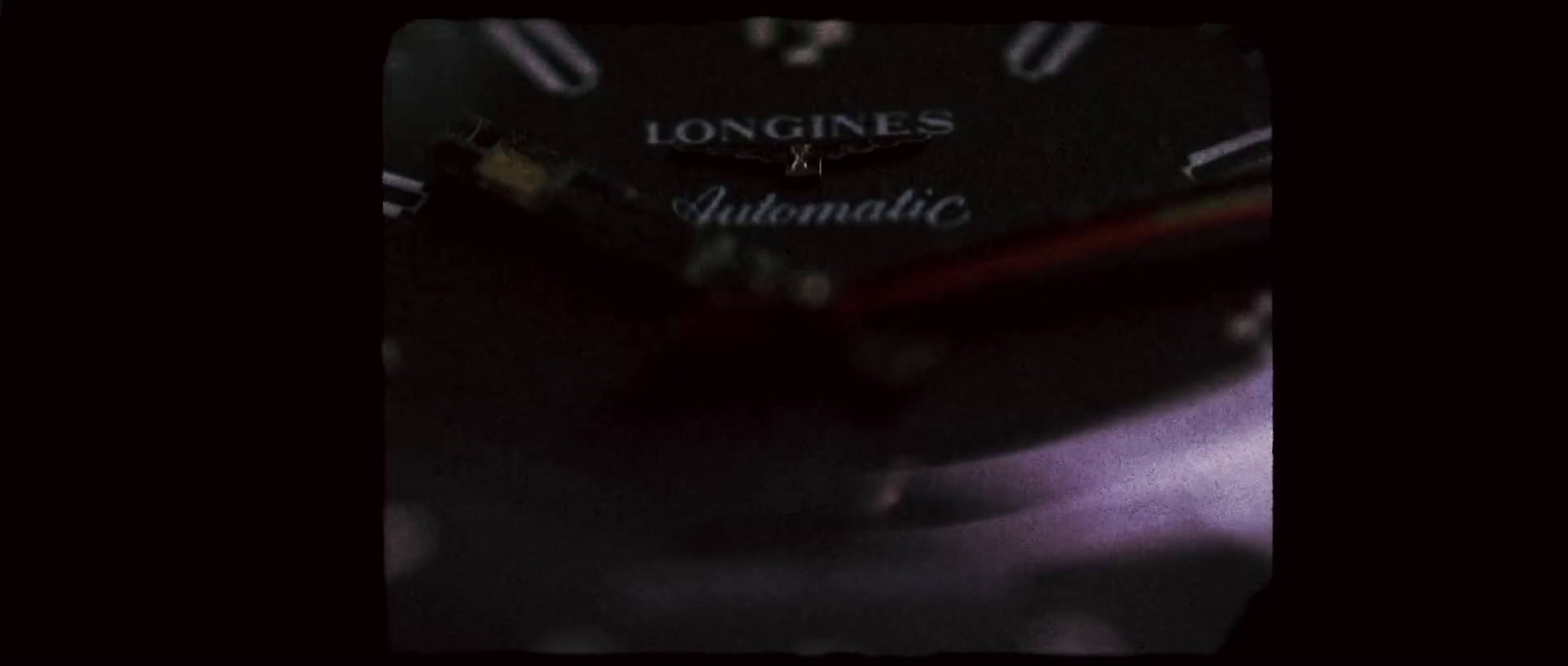 a close up of a speedometer with a dark background