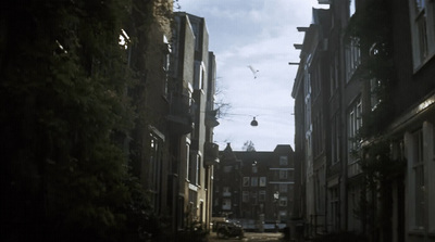 a narrow street with buildings on both sides