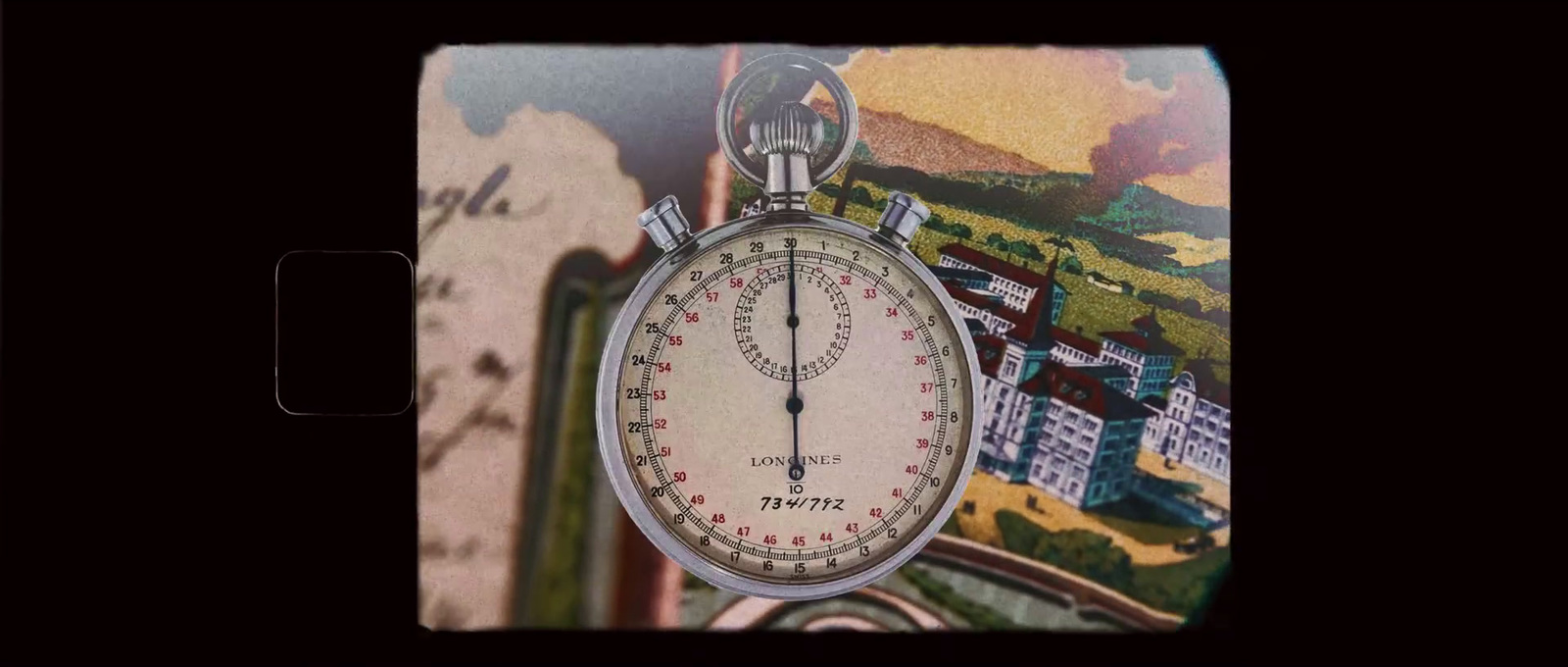 a close up of a pocket watch with a city in the background