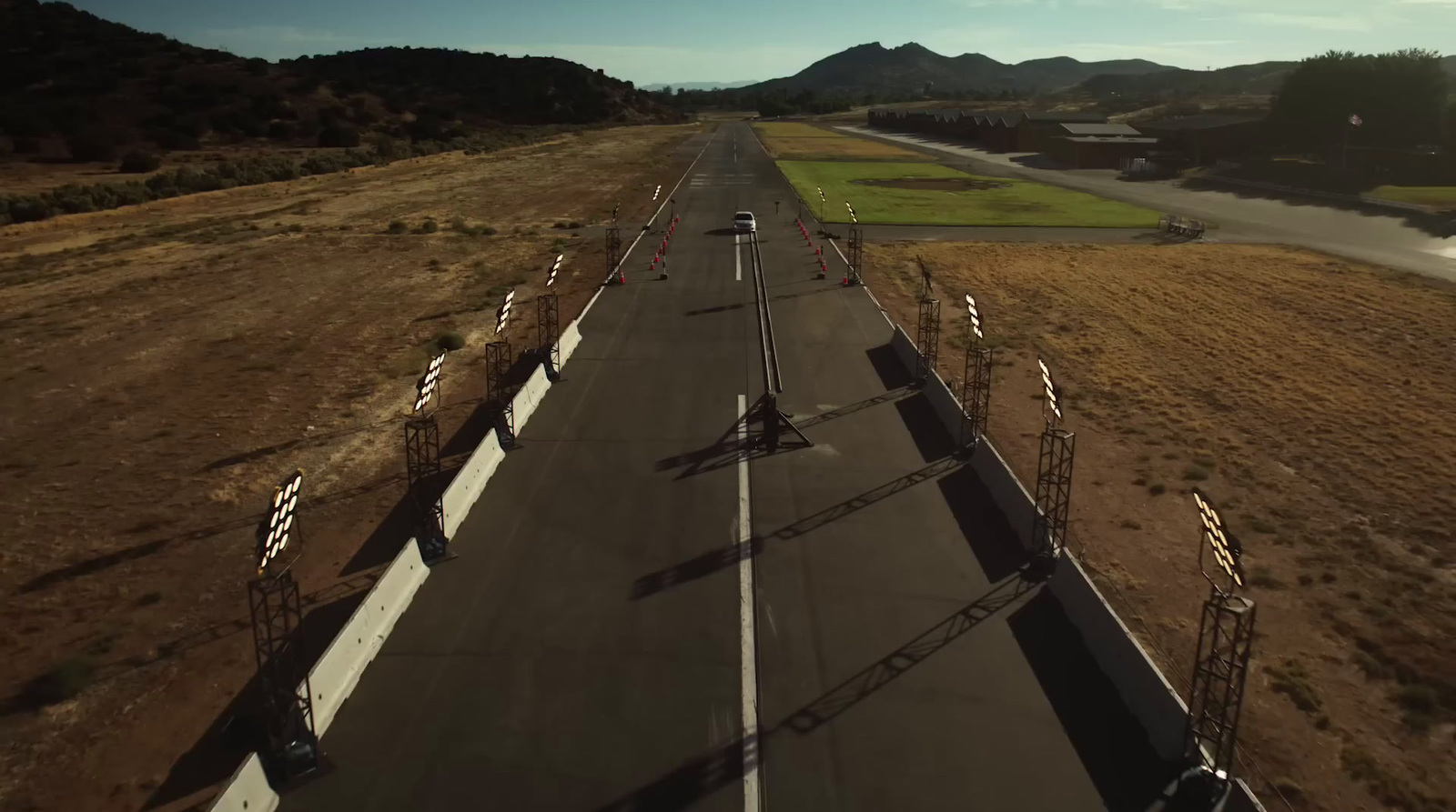 an aerial view of a road in the middle of nowhere