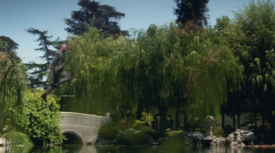 a man flying through the air while riding a skateboard