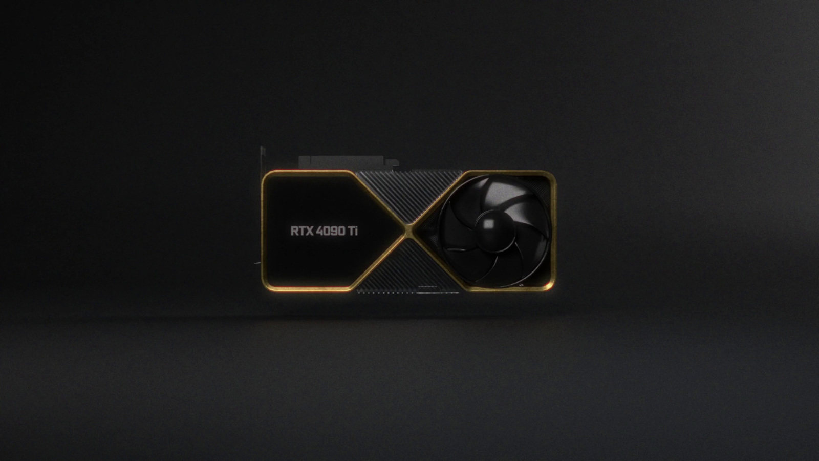 a close up of a black and gold box with a fan