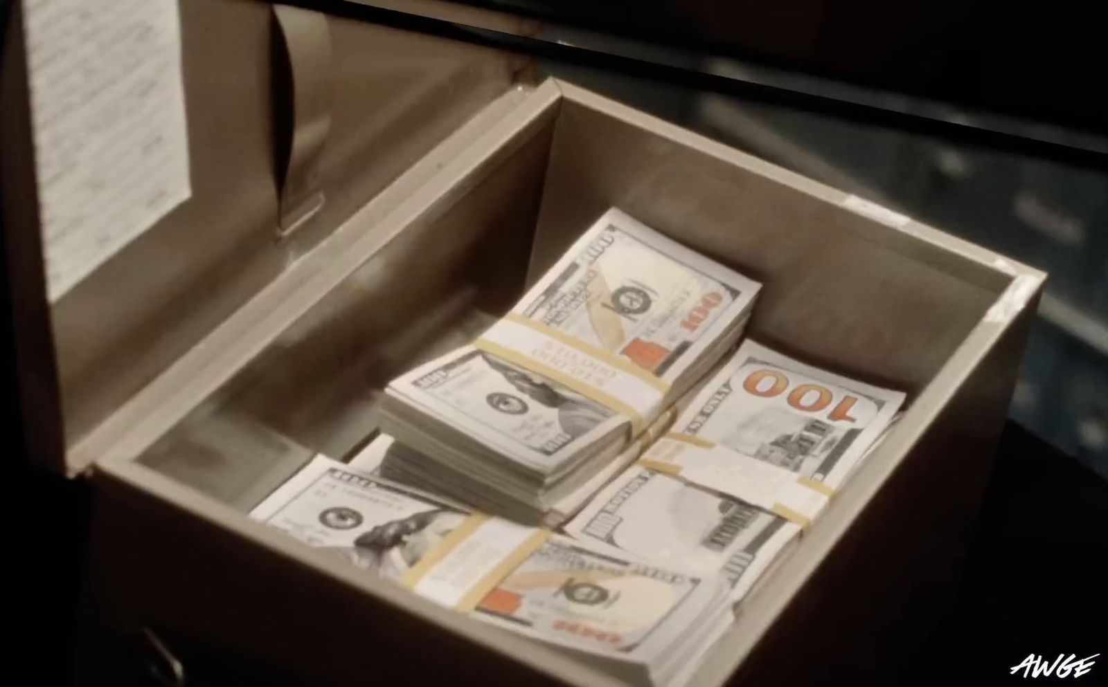 a box filled with lots of money sitting on top of a table