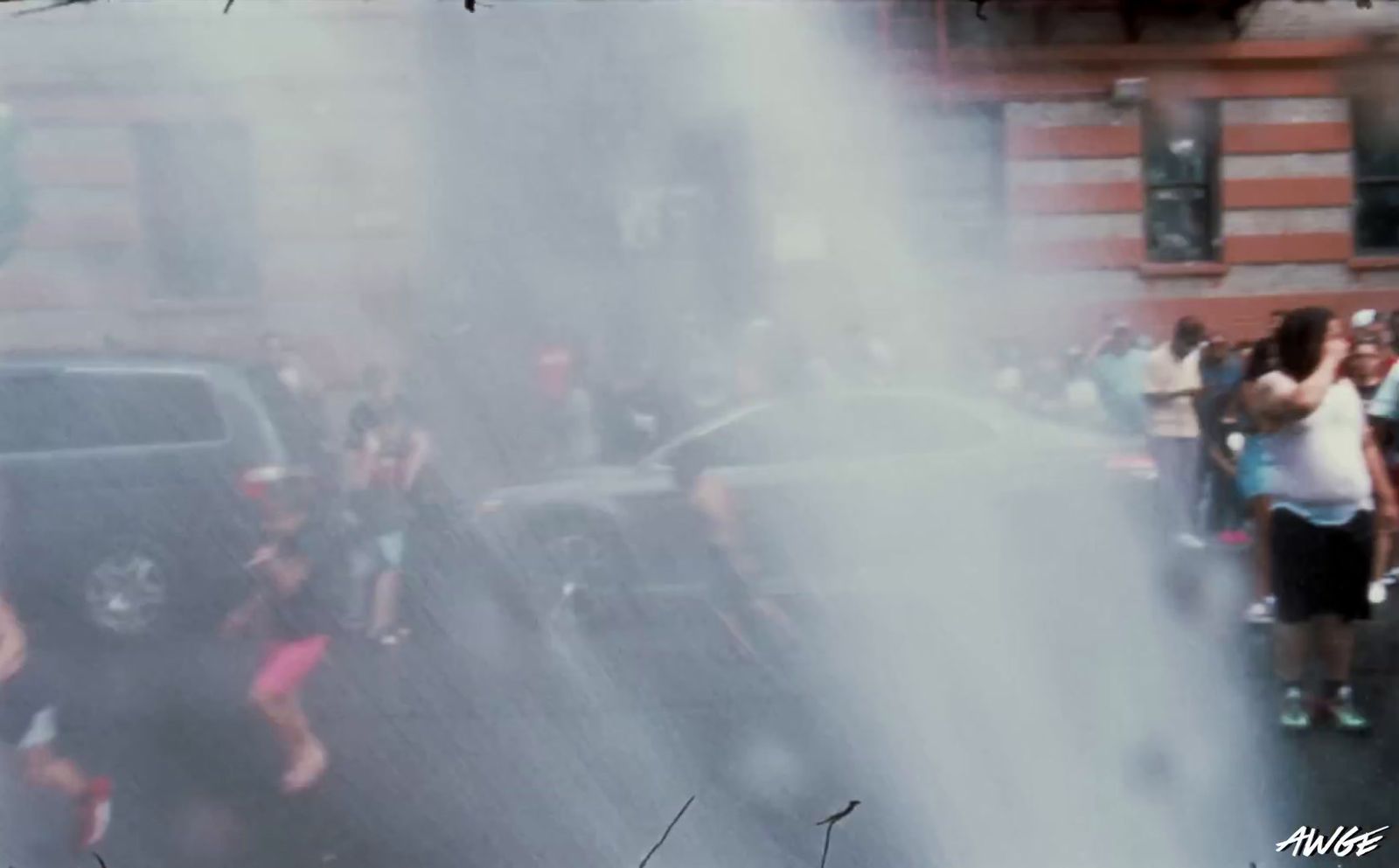 a group of people standing around a fire hydrant