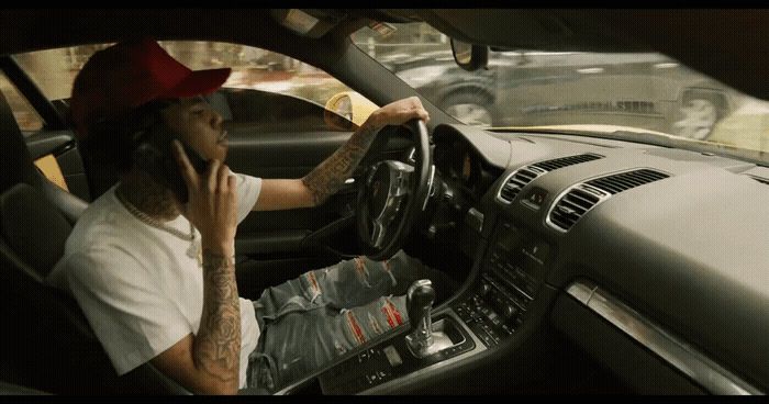 a man driving a car while talking on a cell phone