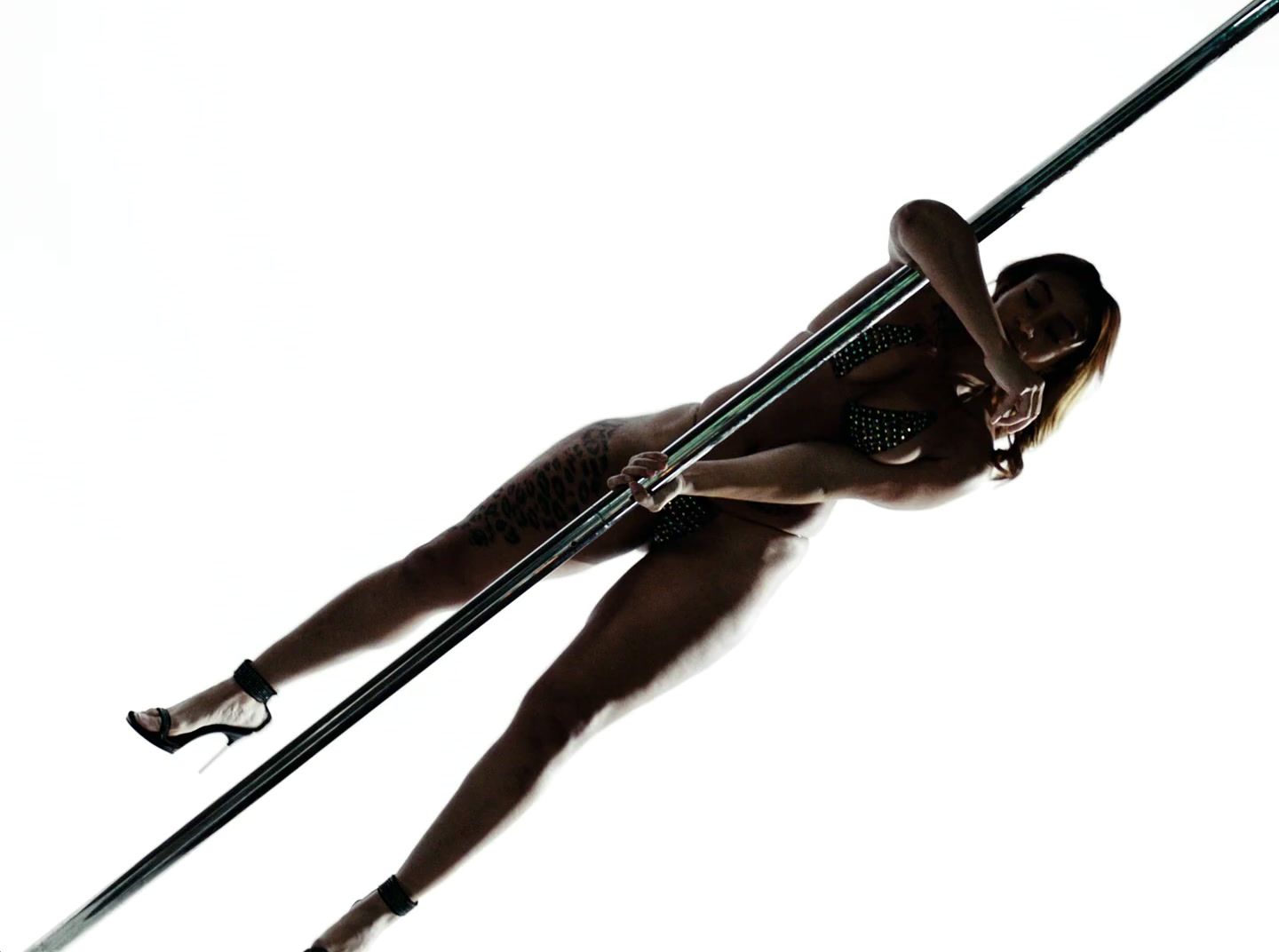 a woman on skis is suspended in the air