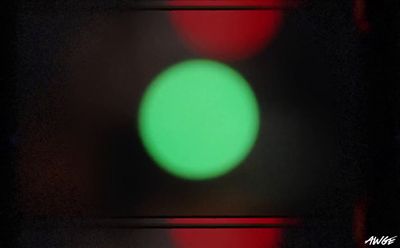 a close up of a traffic light with a blurry background