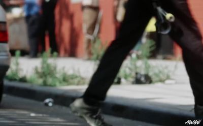 a person walking down a street with a skateboard