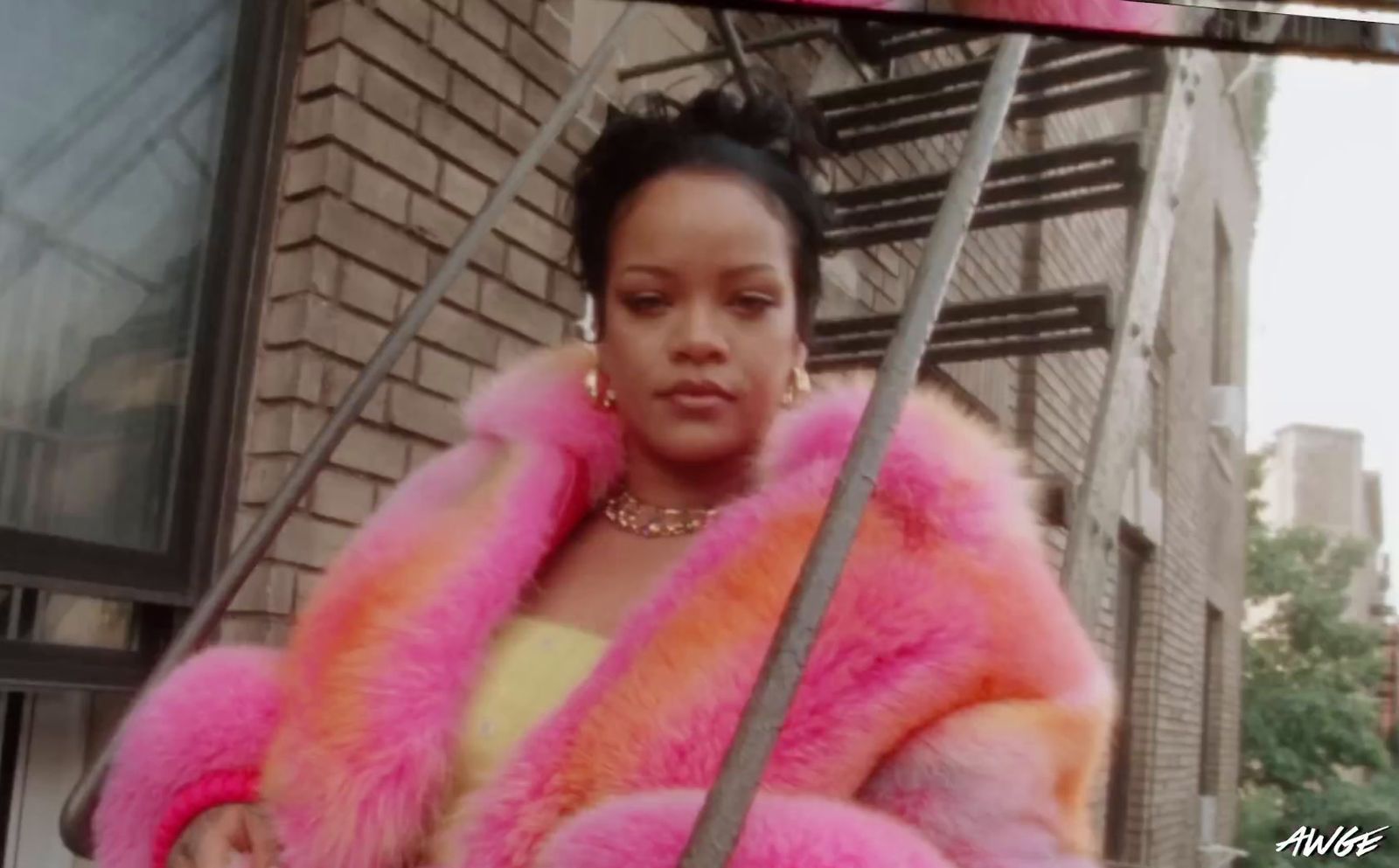 a woman in a pink and orange fur coat