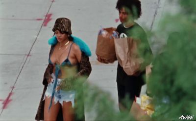 a man and a woman walking down a street