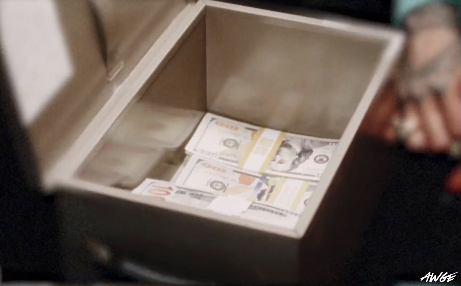 a box filled with lots of money sitting on top of a table