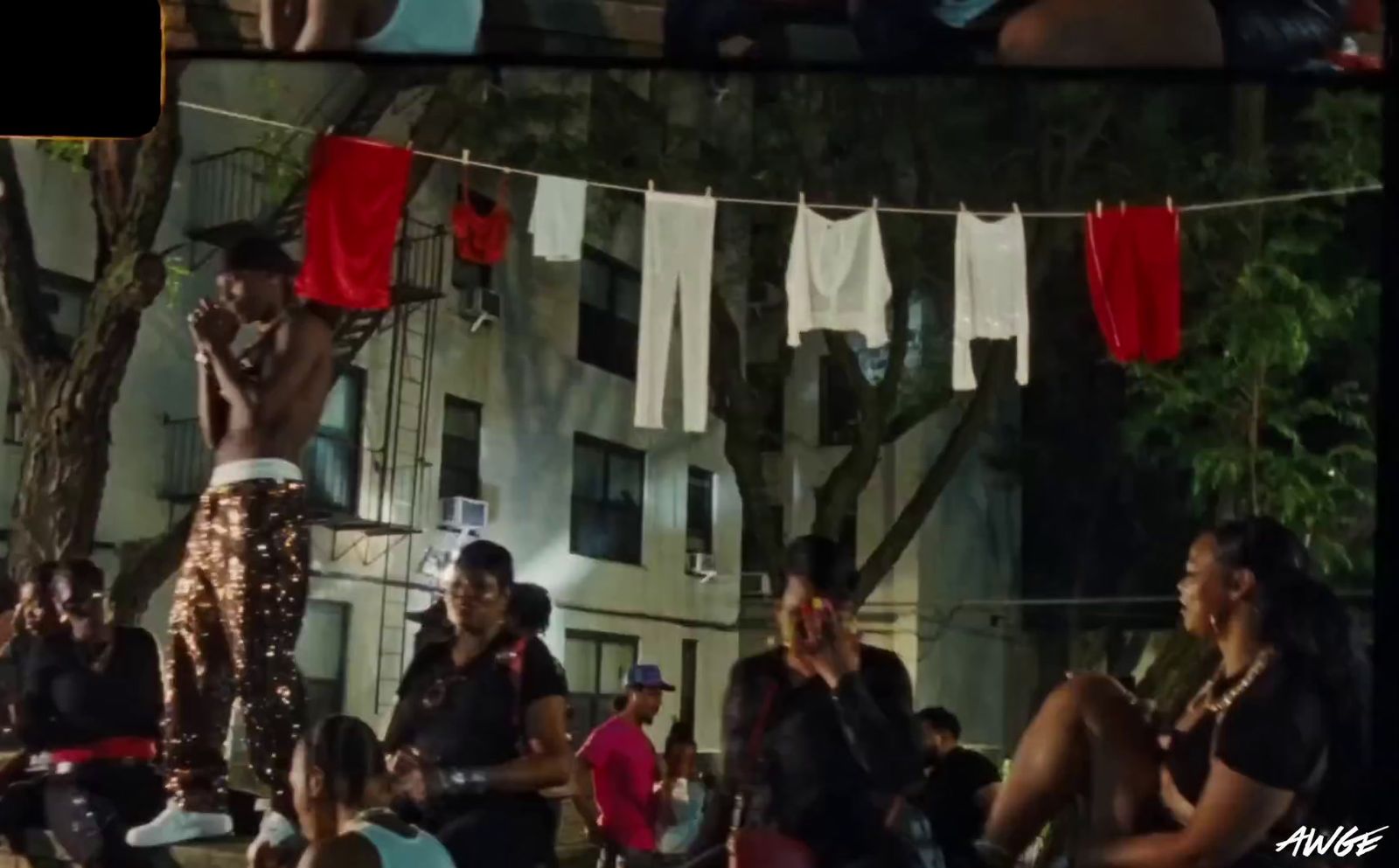 a group of people hanging out clothes on a line