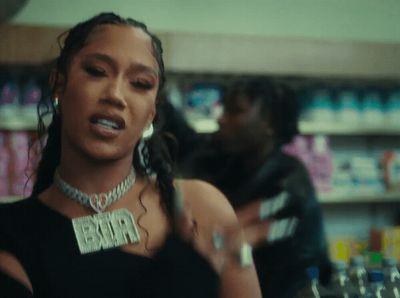 a woman in a store with a necklace on