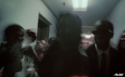 a blurry photo of a group of people in a room