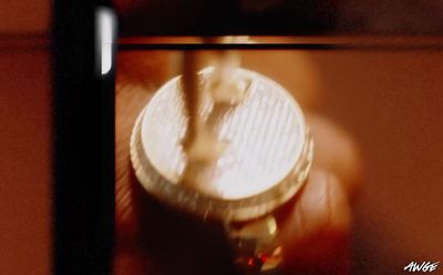 a blurry picture of a person holding a coin